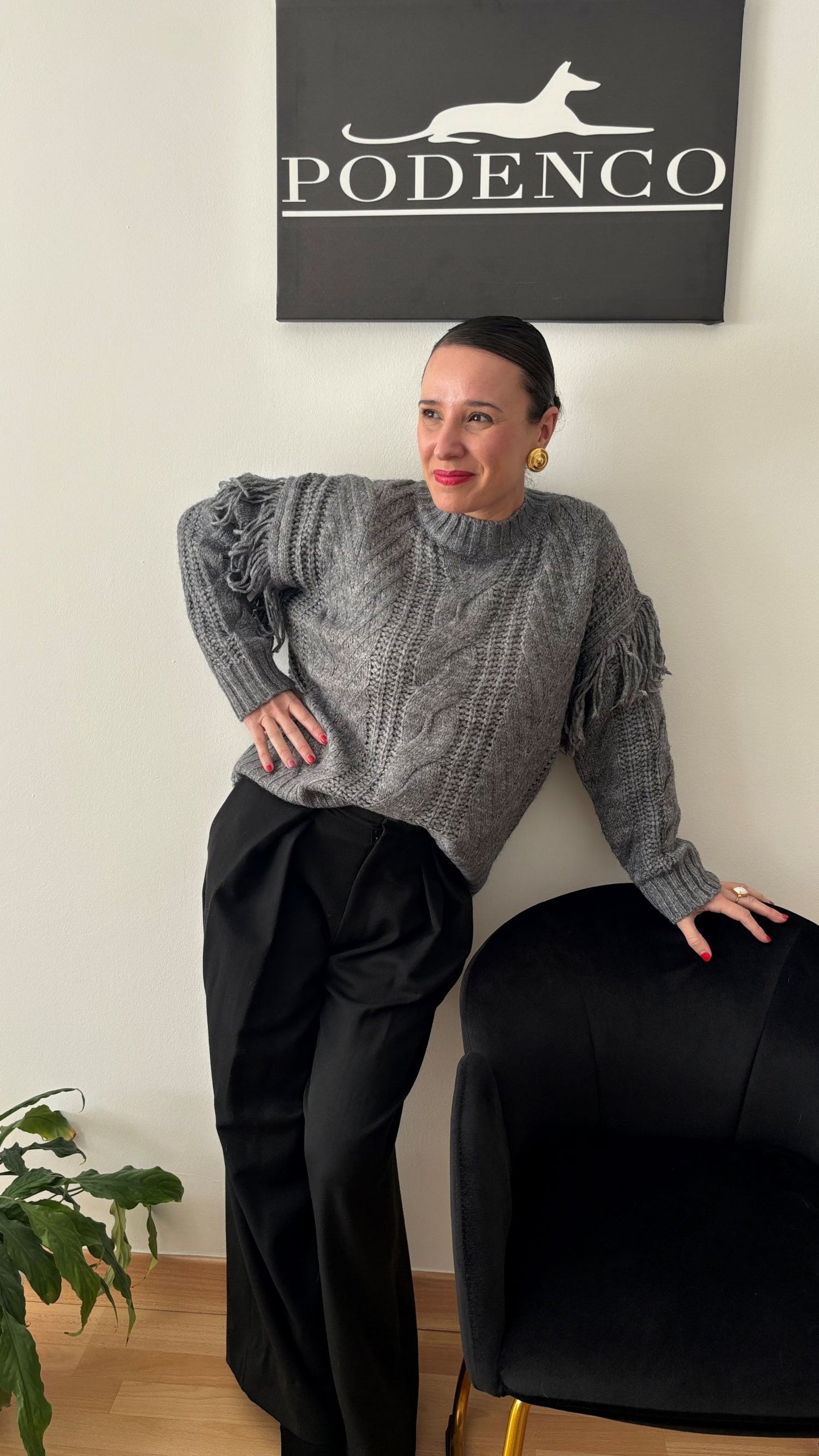 Fringed cable knit sweater